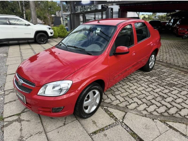 CHEVROLET - PRISMA - 2011/2012 - Vermelha - R$ 34.990,00